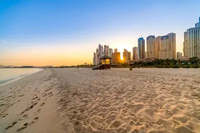 a view of a beach with a city in the background at Dubai Jbr Amazing Penthouse With Stunning View in Dubai