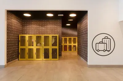 a room with yellow doors and a sign on the wall at Rove Bur Dubai - Healthcare City in Dubai