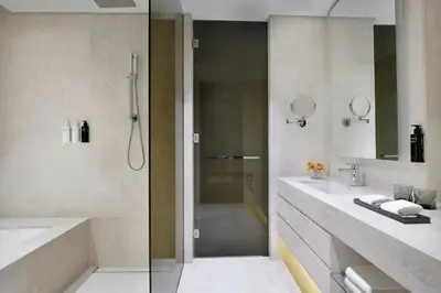 a bathroom with a shower and a sink at La Ville Hotel & Suites CITY WALK Dubai, Autograph Collection in Dubai