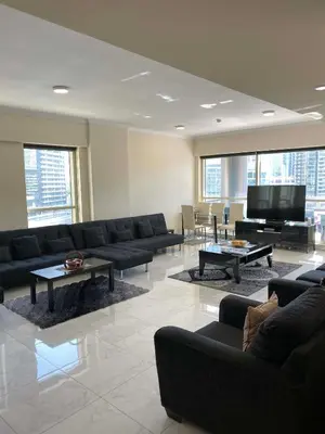 a living room with couches and a flat screen tv at My-Places Dubai Apartment suitable for large groups Al Sahab 1 in Dubai