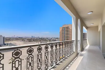 a balcony with a view of a city at Al Khoory Hotel Apartments Al Barsha in Dubai