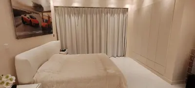 a white room with a bed and a window at JBR Luxury Penthouse with private pool, cinema, gym, spa etc in Dubai