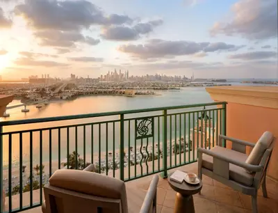 a balcony with a view of a river and a city at Atlantis, The Palm in Dubai