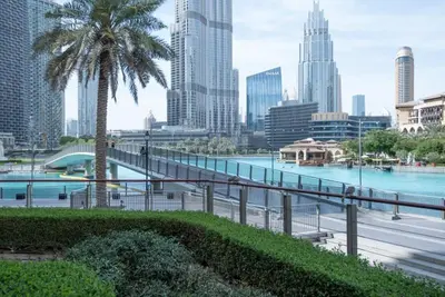 a view of a city with a river and a bridge at New Arabian Burj Residence 1 & 8 Downtown Dubai in Dubai