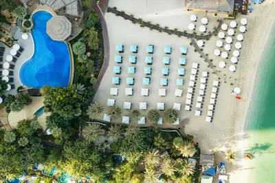 an overhead view of a resort with a pool at Le Meridien Mina Seyahi Beach Resort & Waterpark in Dubai