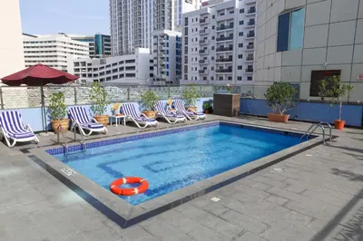 a swimming pool on the roof of a building at Omega Hotel Dubai in Dubai