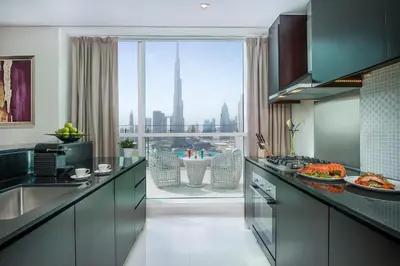 a large kitchen with a view of the city at DAMAC Maison Distinction in Dubai