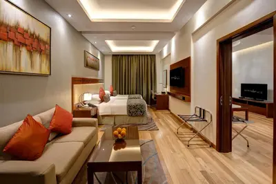 a hotel room with a bed and a couch at Rose Park Hotel - Al Barsha, Opposite Metro Station in Dubai