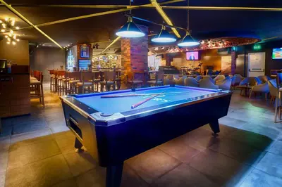 a pool table in a room with a bar at Citymax Hotel Bur Dubai in Dubai