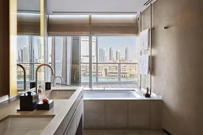 a kitchen with a large window with a large tub at Armani Hotel Dubai, Burj Khalifa in Dubai