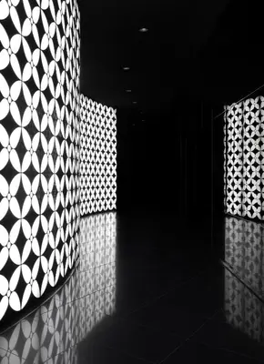 a room with a wall with a patterned wall at Armani Hotel Dubai, Burj Khalifa in Dubai