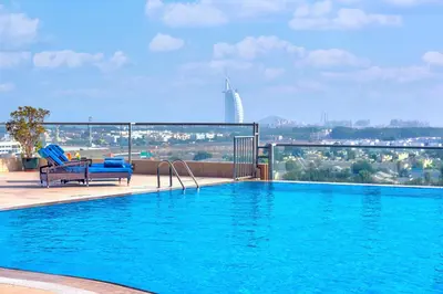 a large swimming pool on top of a building at Two Seasons Hotel & Apartments in Dubai
