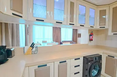 a kitchen with a washer and dryer in it at Barceló Residences Dubai Marina in Dubai