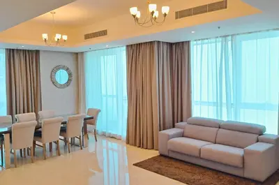 a conference room with a couch and a table and chairs at Barceló Residences Dubai Marina in Dubai