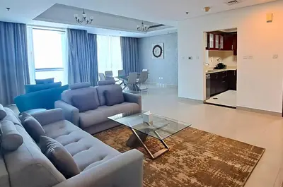 a living room with couches and a dining room at Barceló Residences Dubai Marina in Dubai