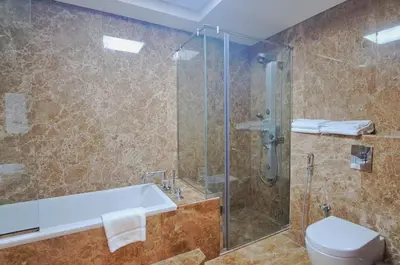 a bathroom with a shower and a sink and a toilet at Barceló Residences Dubai Marina in Dubai