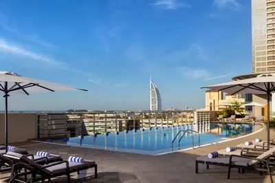 a swimming pool on the roof of a building at Staybridge Suites Dubai Internet City by IHG in Dubai