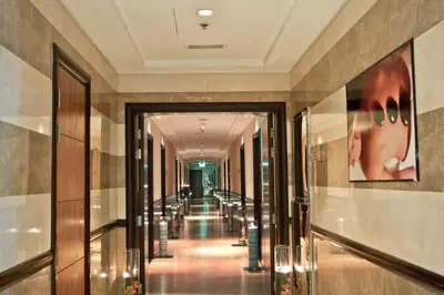 a hallway of a building with a long corridor at Ramee Rose Hotel in Dubai