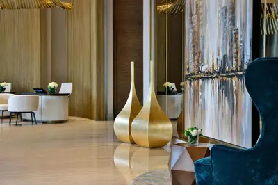 a lobby with a large gold vase on the floor at The St. Regis Downtown Dubai in Dubai