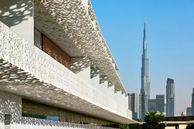 a facade of a building with a skyscraper at Bvlgari Resort Dubai in Dubai