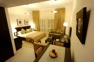 a hotel room with a bed and a table with bananas on it at Gulf Oasis Hotel Apartments Fz LLC in Dubai