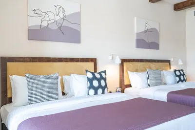 two beds sitting next to each other in a room at Beach Walk Boutique Jumeirah in Dubai