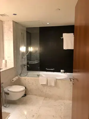 a bathroom with a tub and a toilet and a sink at Address Dubai Mall Fashion Avenue 1 bedroom 23 floor in Dubai