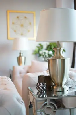 a lamp on a table in a living room at Elite Royal Apartment - Full Burj Khalifa & Fountain view - Opal - 2 bedrooms plus 1 open bedroom without partition in Dubai