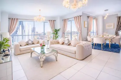 a living room with two couches and a table at Elite Royal Apartment - Full Burj Khalifa & Fountain view - Opal - 2 bedrooms plus 1 open bedroom without partition in Dubai