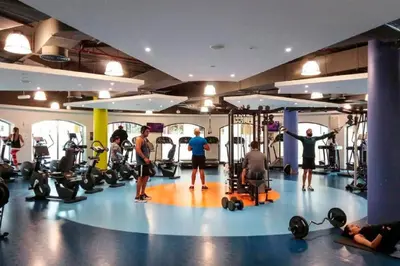 a group of people exercising in a gym at Jbr beach walk 2 bedrooms front sea in Dubai