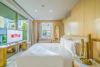 a hotel room with a large bed and a window at FIVE Palm Beach Villa -Private Pool & Roopftop Jacuzzi, 3-Level, by Exclusive Holiday Homes in Dubai