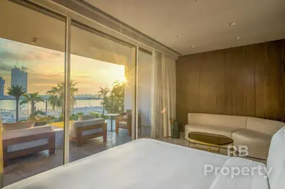 a bedroom with a bed and a view of the ocean at FIVE Palm Beach Villa -Private Pool & Roopftop Jacuzzi, 3-Level, by Exclusive Holiday Homes in Dubai