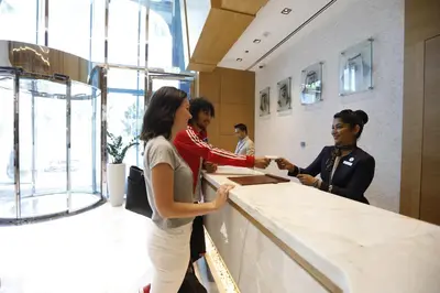 a group of people standing around a counter at Gulf Inn Hotel Al Nasr Formerly Roda Links Al Nasr in Dubai