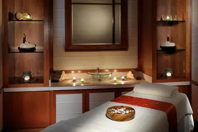 a room with a bed with a cake on it at Crowne Plaza - Dubai Jumeirah by IHG in Dubai