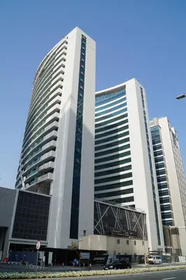a large building with two tall buildings at Dubai Downtown View in Dubai