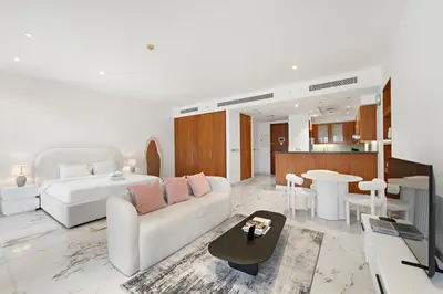a living room with a couch and a table at Studio Central Park DIFC in Dubai