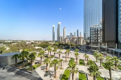 a view of a city with palm trees and buildings at Studio Central Park DIFC in Dubai