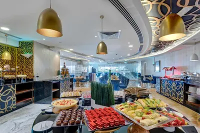 a buffet with many different types of food on display at Gevora Hotel in Dubai