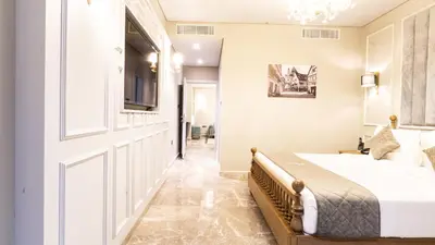 a bedroom with a bed and a sliding door at President Hotel in Dubai