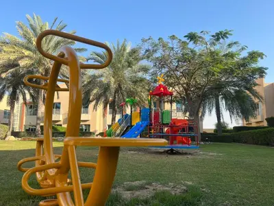 a playground in a park with a colorful playground at Coral Boutique Villas in Dubai