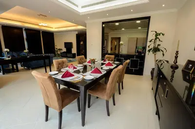 a dining room with a table and chairs at Coral Boutique Villas in Dubai