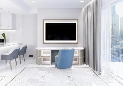 a living room with a tv and a blue chair at Westminster Dubai Mall in Dubai