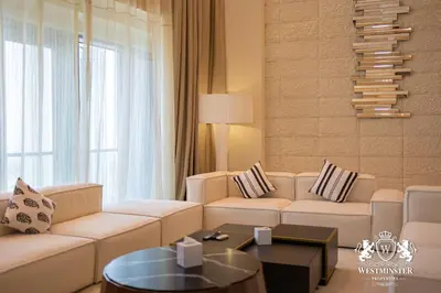 a living room with a couch and a table at Westminster Dubai Mall in Dubai