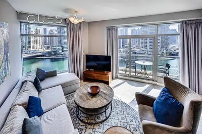 a living room with a couch and a large window at Park Island, Dubai Marina in Dubai