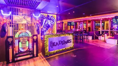 a bar with a sign that says its a dinks at Stella Di Mare Dubai Marina Hotel in Dubai
