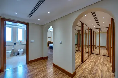 a room with a hallway with a mirror and a bedroom at J5 Villas Holiday Homes Barsha Gardens in Dubai