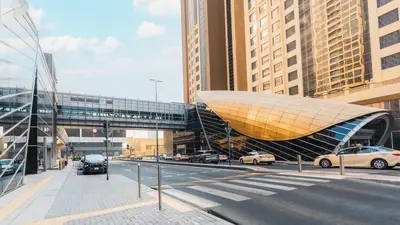 a building in a city with cars on a street at Citadines Metro Central Dubai in Dubai