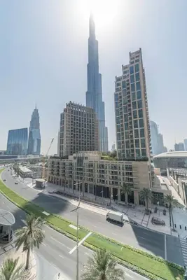 a view of a city with tall buildings and a street at Divine Burj & Opera Views - 2BDR - DOWNTOWN DUBAI in Dubai