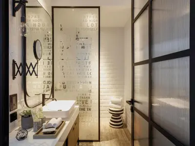 a bathroom with a sink and a mirror at Zabeel House The Greens by Jumeirah in Dubai