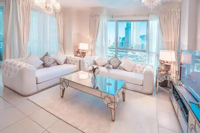 a living room with two couches and a tv at Elite Royal Apartment - Full Burj Khalifa & Fountain View - Crystal in Dubai